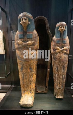 Munich, Germany - 30 Mar 24: Museum display featuring painted Egyptian coffins and an open coffin case at the Munich Museum of Egyptian Art. Stock Photo