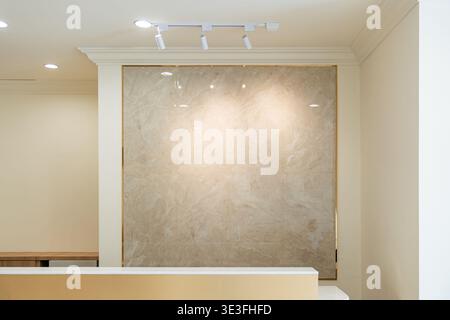 Minimal luxury interior with a marble wall and soft lighting in a modern architectural space creating a refined and elegant atmosphere. Stock Photo