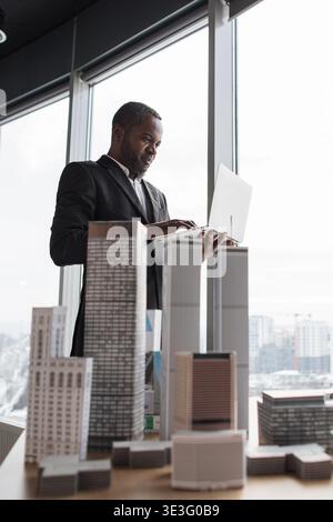 Architect Reviews Building Models Stock Photo
