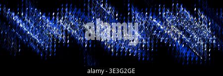 Abstract Blue Glowing Wavy Light Strands on Black Stock Photo