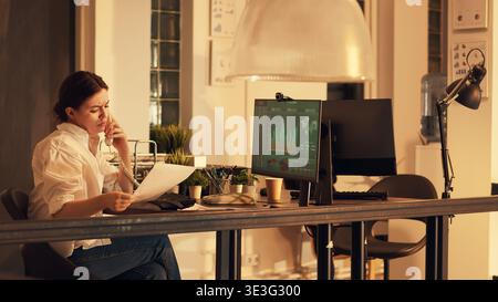 Freelancer working with charts and graphs on computer, analyzing financial data on diagrams to plan executive report. Using analysis on company network to create professional presentation. Stock Photo