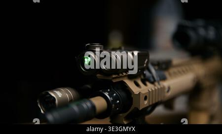 Tactical rifle with mounted laser and flashlight attachments Stock Photo