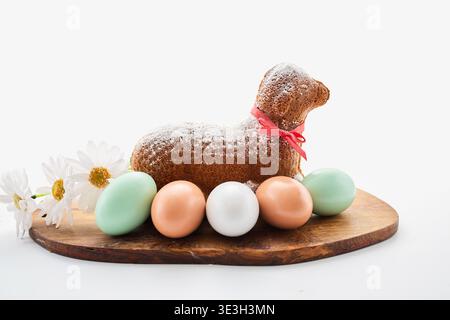 Easter lamb cake with eggs and daisies celebrating spring Stock Photo