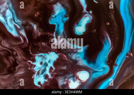 Abstract navy blue and turquoise fluid marbling with bubbles. Stock Photo