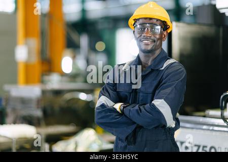 Professional African Black Young Worker Man Engineer in factory Confident Success Happy Smiling. Stock Photo