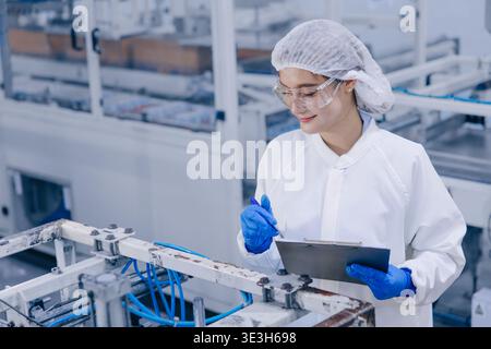 Hygiene inspector certify stuff officer work in science factory laboratory. people in pharmaceutical medicine production process inspector. Stock Photo