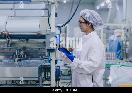 Hygiene inspector certify stuff officer work in science factory laboratory. people in pharmaceutical medicine production process inspector. Stock Photo