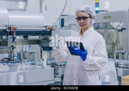 Hygiene inspector certify stuff officer work in science factory laboratory. people in pharmaceutical medicine production process inspector. Stock Photo