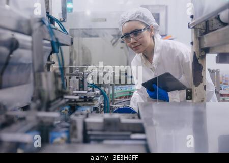 Hygiene inspector certify stuff officer work in science factory laboratory. people in pharmaceutical medicine production process inspector. Stock Photo