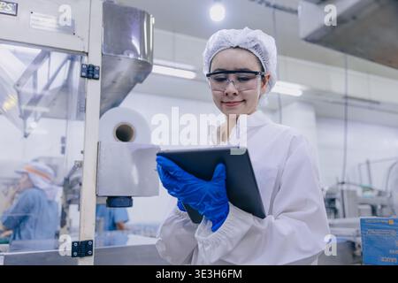 Hygiene inspector certify stuff officer work in science factory laboratory. people in pharmaceutical medicine production process inspector. Stock Photo