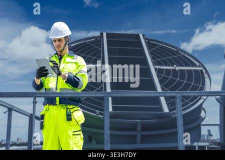 Professional Worker Team Servicing HVAC building cooling tower, Industry air conditioner training service Stock Photo