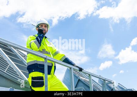 Professional Worker Servicing HVAC Modern office building Cooling tower, Industry Large Air conditioner system expert team service. Stock Photo