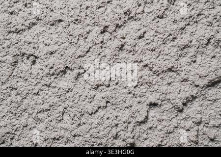 Textured Surface with Intricate Patterns and Subtle Color Variations in a Plaster Finish Stock Photo