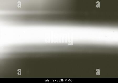 Soft gray gradient with subtle glow, distressed surface featuring noise and scratches, front view banner, ample copy space Stock Photo