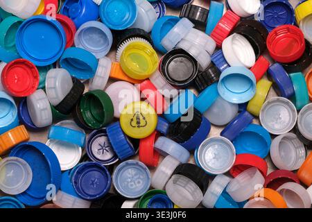 Large pile of colorful plastic bottle caps for recycling Stock Photo
