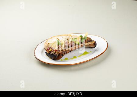 Bone marrow with beef tartare and bread slices Stock Photo