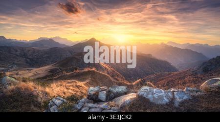 Stones and mountains at colorful sunset in autumn Stock Photo