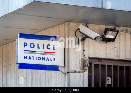 Sign reading 'POLICE NATIONALE' next to a surveillance camera outside a French police station. Concepts of crime and video surveillance in France Stock Photo