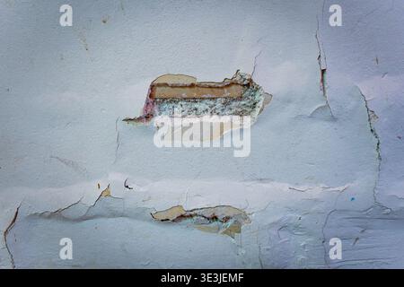 crack white concrete wall background, old worn out bricks wall with hole, painter and renovation work Stock Photo