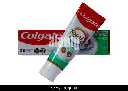 Box of Colgate Total Active Prevention toothpaste with tube removed isolated on white background new formula deep clean in hard to reach places Stock Photo
