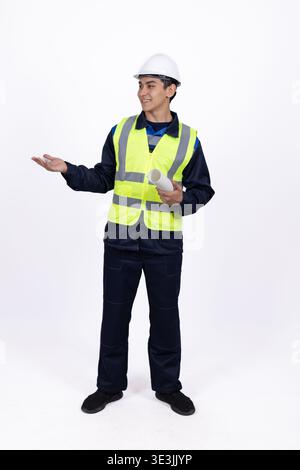 Man in safety vest gesturing and looking aside on white background Stock Photo