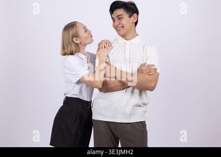 Happy man and woman looking at each other in the studio Stock Photo