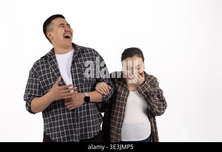 Man and woman laughing together in studio Stock Photo
