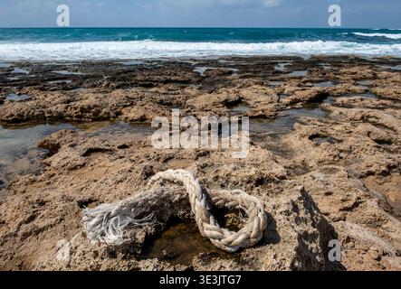 A piece of ship rope washed up on the coastline at Paphos, Cyprus. Stock Photo
