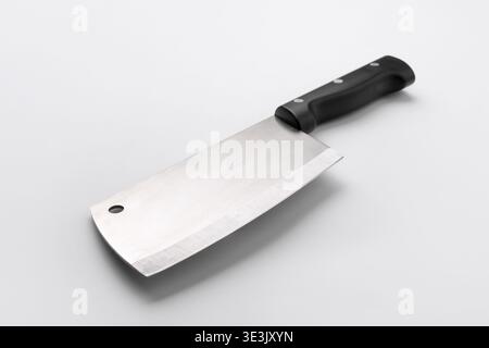 High-quality stainless steel meat cleaver with black handle, isolated on white background. Perfect for kitchen, cooking, or culinary themes. Stock Photo