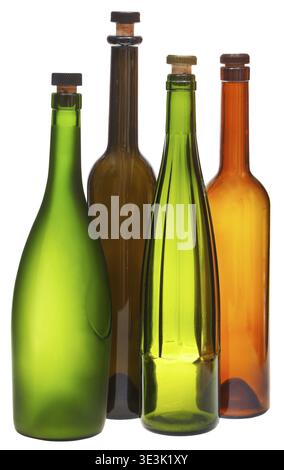 Side view of colored empty closed wine bottles against white background Stock Photo