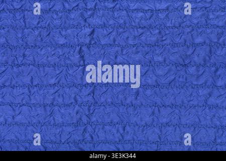 Textile background made from stitched, wrinkled blue silk fabric Stock Photo