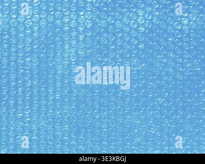 Bubble wrap background on blue water, close-up Stock Photo