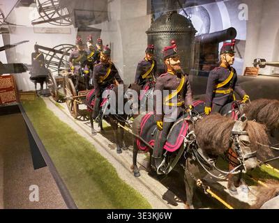 A museum diorama display featuring historical military figures on horseback. The scene depicts several uniformed cavalry soldiers wearing dark navy Stock Photo