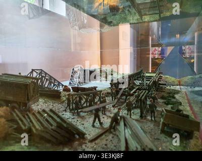 A detailed diorama or scale model depicting military bridge construction, displayed behind glass in what appears to be a museum or exhibition Stock Photo