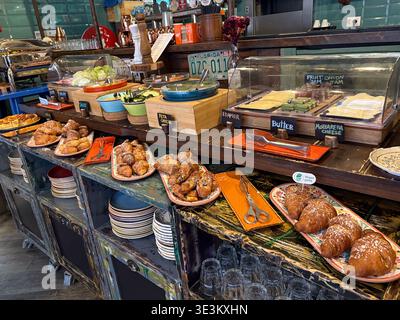 Assorted breakfast buffet with croissants, feta, mozzarella cheese, and salad in Rome, Italy. Hotel dining experience. Stock Photo