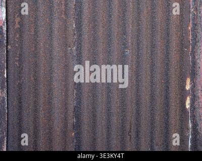Industrial background featuring rust and corrugated structure. Stock Photo