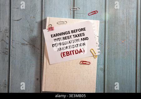 Earnings Before Taxes word written on wood block. abbreviation EBT text on cement table for your desing, concept. Stock Photo