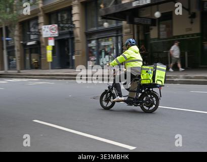 SYDNEY - JAN 02 2026: Uber Connect courier delivery service. In Australia, 90% of Uber Eats delivery people cite flexibility as a key reason for worki Stock Photo