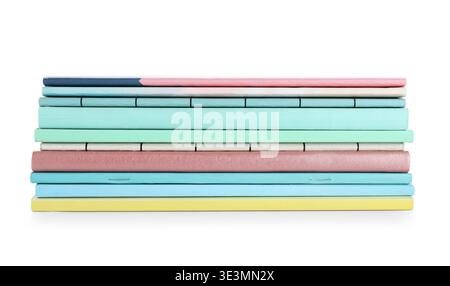 Stack of many different notebooks isolated on white background Stock Photo