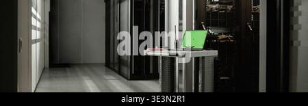 Rolling Workstation Featuring Laptop and Tools Positioned in Server Room Stock Photo