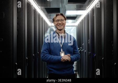 Portrait of Middle Aged Caucasian Man Smiling Standing in Data Center Stock Photo