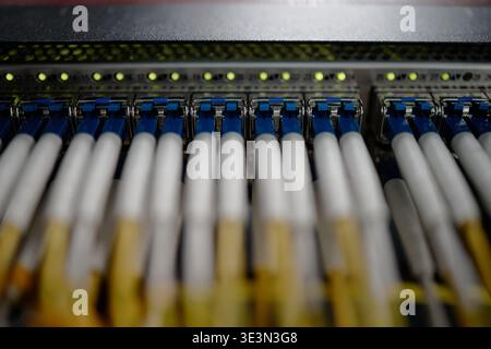 Network Cables Connecting to Server Rack in Data Center Environment Stock Photo
