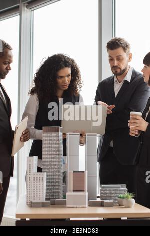 Architects Discussing Building Models Stock Photo