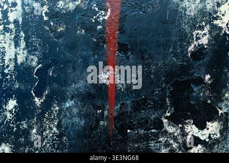 Dark Grungy Wall with Red Spray Paint Street Art Texture Stock Photo