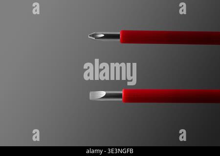 Insulated rods of dielectric screwdrivers. Close-up. Isolated on grey background. Stock Photo