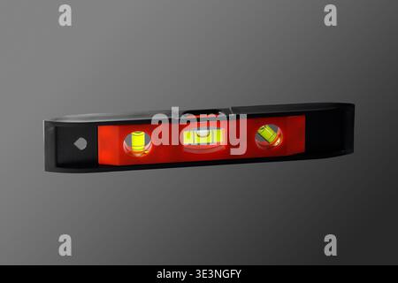 Plastic small building level. Close-up. Isolated on grey background. Stock Photo