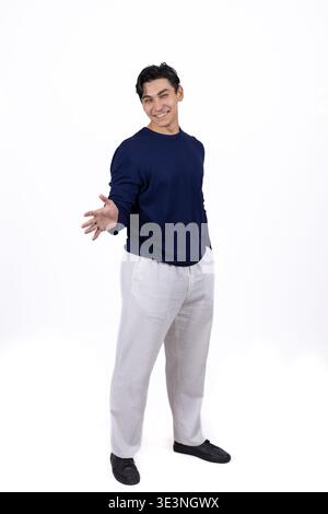 Thoughtful man pointing his finger aside on white background Stock Photo
