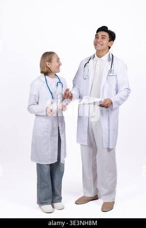 Two medical doctors in white coats posing together Stock Photo