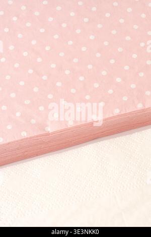 Polka dot fabric on a table with a white surface underneath during daylight Stock Photo