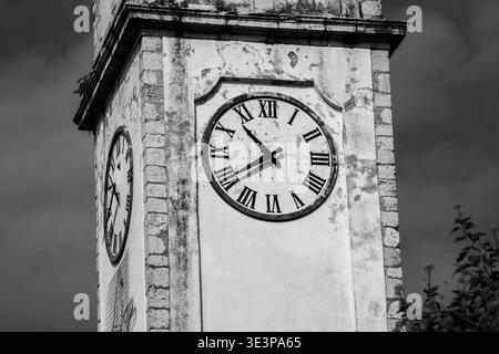 ancient clock of the bell tower of the church of Olmo in Cogollo del Chengio, ancient church at the foot of the Asiago plateau Stock Photo